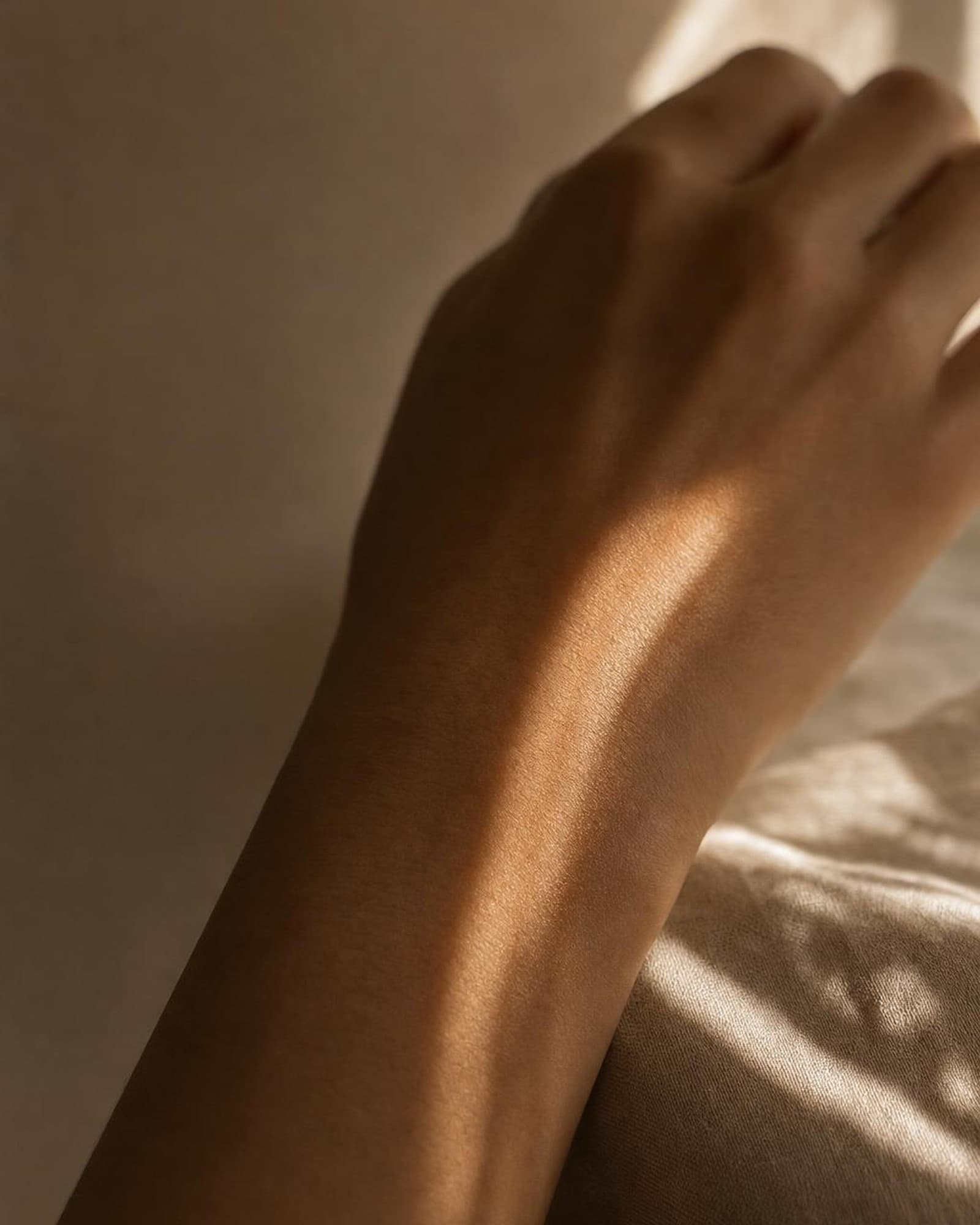 A stripe of warm afternoon light across skin — light as gentle therapy.