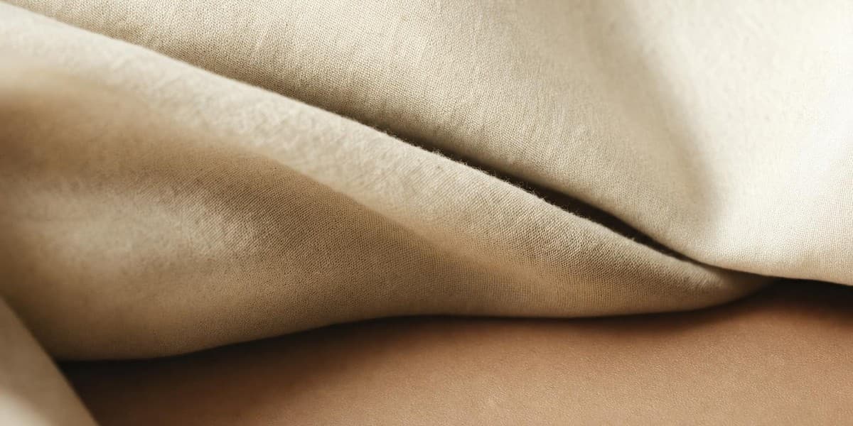 Warm linen folds in afternoon light.
