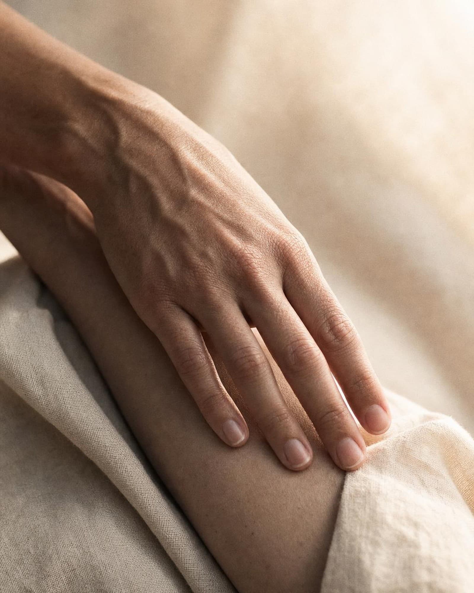 A still life of warm linen folds in afternoon light — careful, considered attention.